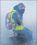  ??  ?? ACTION: Marcher in Paris yesterday