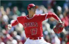  ?? BEN MARGOT — THE ASSOCIATED PRESS FILE ?? Los Angeles Angels’ Shohei Ohtani delivers a pitch against the Brewers in a Spring Training game. How often the Japanese sensation hits and pitches this season will be an intriguing storyline to watch.
