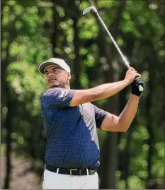  ?? Sam Greenwood / Getty Images ?? Sebastian Munoz of Colombia plays a shot on the seventh hole during the third round of the Byron Nelson. He shot 66.