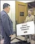  ??  ?? Advocate holding sign makes case at Senate Majority Leader John Flanagan’s office Monday.