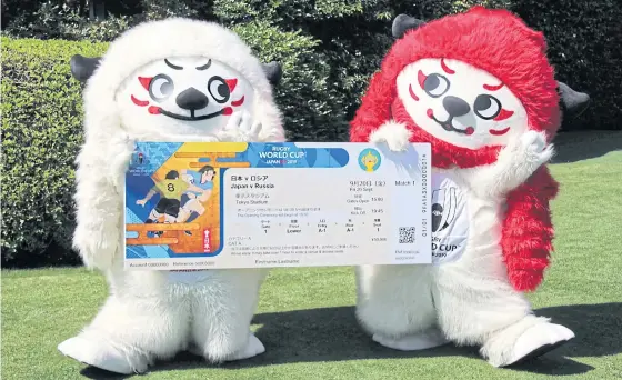  ??  ?? Ren and G, the mascots of the 2019 Rugby World Cup, hold a replica ticket for the tournament in Tokyo.