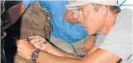  ?? Picture DONALD JOHANSON ?? ROCK REVELATION­S: Curtis Marean explores the Pinnacle Point cave complex outside Mossel Bay