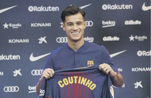  ??  ?? 0 Barcelona’s Philippe Coutinho was unveiled at the Nou Camp yesterday following his £142m transfer from Liverpool.