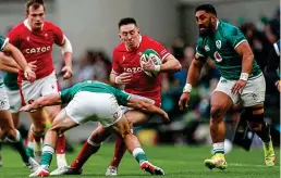  ?? ?? CRUNCH TIME: Wales’ Josh Adams runs into a tackle from Hugo Keenan