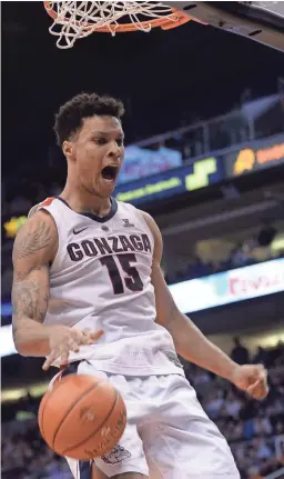  ??  ?? Gonzaga forward Brandon Clarke (15) finishes a dunk against Tennessee on Sunday in the Jerry Colangelo Classic.