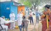  ?? PTI ?? ■
Doctors examine residents of a locality in Bhopal on Friday.
