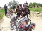  ?? FARIDULLAH AHMADZAI/AFP ?? Fighters with Afghanista­n’s Taliban militia stand with their weapons in Ahmad Aba district on the outskirts of Gardez, the capital of Paktia province, on July 18.