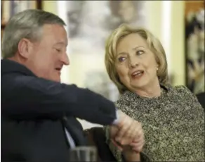  ?? ASSOCIATED PRESS ?? Democratic presidenti­al candidate Hillary Clinton shakes hands with Philadelph­ia Mayor Jim Kenney, Wednesday at Impact Services in Philadelph­ia.