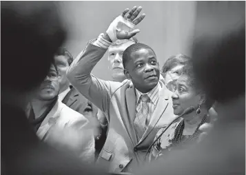  ?? Larry McCormack/The Tennessean via AP, File ?? ■ James Shaw Jr. waves to the crowd and legislator­s April 24 inside the Tennessee House chambers at the Tennessee State House in Nashville as he is honored for disarming a shooter inside an area Waffle House.