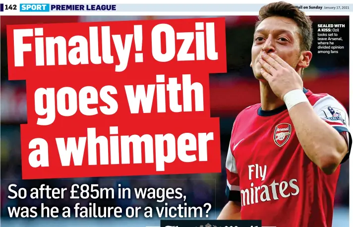  ??  ?? SEALED WITH A KISS: Ozil looks set to leave Arsenal, where he divided opinion among fans