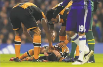  ?? Richard Heathcote / Getty Images ?? Hull’s Ryan Mason lies injured after a collision with Chelsea’s Gary Cahill during the English Premier League match. Mason is hospitaliz­ed with a fractured skull.