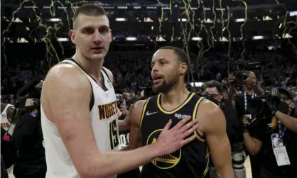  ?? Photograph: Jed Jacobsohn/AP ?? Nikola Jokic left with Stephen Curry, who won the MVP award two years in succession in 2015 and 2016.
