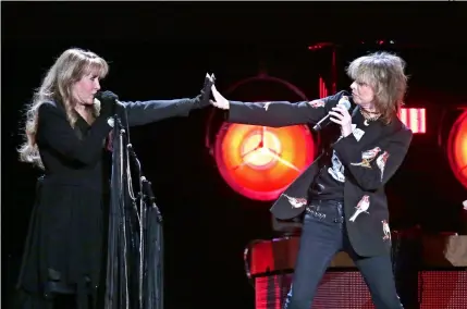  ??  ?? The odd couple: Stevie Nicks (left) and Chrissie Hynde
on stage in New Jersey, April 2, 2017.