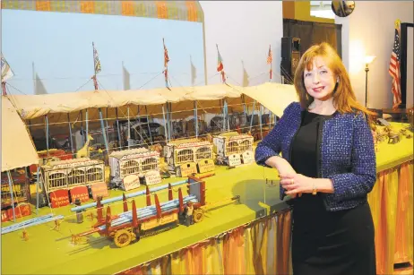  ?? Christian Abraham / Hearst Connecticu­t Media ?? Kathleen Maher, executive director of the Barnum Museum, in downtown Bridgeport on Wednesday. Maher stands next to a miniature model of the Ringling Bros. and Barnum & Bailey Circus originally built in the 1920s. Maher was on hand to talk about the...