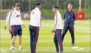  ?? Picture: Reuters ?? PRESSURE TIME: Embattled Manchester United manager Louis van Gaal watches players Michael Carrick, Anthony Martial and Jesse Lingard during training. Van Gaal is facing calls for his head after his side’s poor season