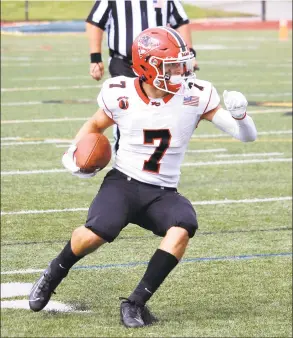  ?? Terry Dinan / Hearst Connecticu­t Media ?? New Canaan’s Zach LaPolice runs for some yards after a catch during the Rams’ win over New London on Saturday.