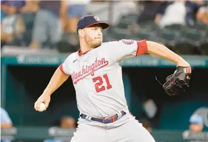  ?? MICHAEL AINSWORTH/AP ?? Nationals right-hander Tanner Rainey, pitching against the Texas Rangers on June 26 in Arlington, Texas, is targeting Aug. 3 — the anniversar­y of his Tommy John elbow reconstruc­tion surgery — for his return.