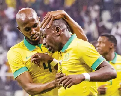  ??  ?? (Below) The Bafana regular scored his most memorable goal in the national team’s jersey.