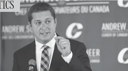  ?? JOHN WOODS / THE CANADIAN PRESS ?? Conservati­ve Party of Canada Leader Andrew Scheer speaks at a caucus meeting in Winnipeg, Thursday, hammering the Liberals’ tax reform plan.