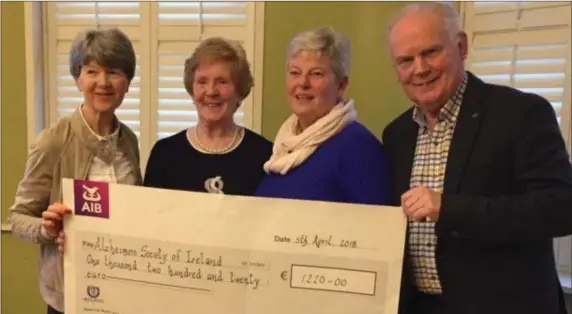 ??  ?? Ann Shortt and Noel Heeney from Alzheimer’s, Drogheda branch receiving a cheque from Olive Sharkey president of the Bridge club with incoming president Ruth Smyth .