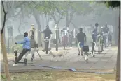  ?? — PTI ?? People exercise in a park amid dense fog in New Delhi one Saturday.