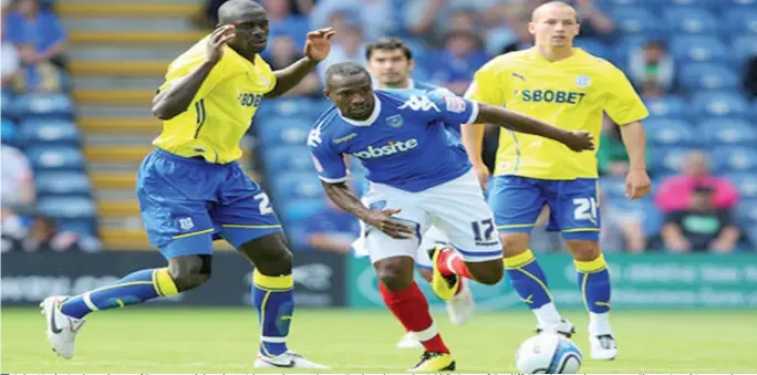  ??  ?? John Utaka in the colours of Portsmouth battles with another ex-Super Eagles player Seyi Olifinjana of Cardiff City during the npower Championsh­ip match between at Fratton Park on August 28, 2010