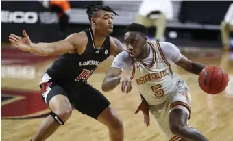  ?? AP ?? BRICK WALL: Jay Heath and Boston College could not overcome a strong Louisville defense in a 76-64 loss in ACC play yesterday.