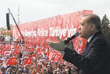  ?? Kayhan Ozer / Presidenti­al Press Service ?? Turkish President Recep Tayyip Erdogan addresses supporters during a referendum rally in Konya. Voters are being asked to approve constituti­onal reforms to expand the president’s powers.