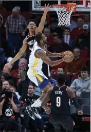  ?? CRAIG MITCHELLDY­ER — THE ASSOCIATED PRESS ?? Warriors guard Alec Burks, right, shoots over Trail Blazers guard Anfernee Simons during the second half on Monday in Portland, Ore.