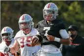  ?? Adam Cairns / Tribune News Service ?? Ohio State coach Ryan Day says QB C.J. Stroud (7) won the job with his decision-making and leadership skills.