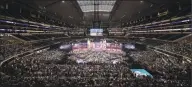  ?? David J. Phillip / Associated Press ?? This April 26, 2018, file photo, shows a general overall view of AT&T Stadium as Georgia’s Roquan Smith is selected by the Chicago Bears during the first round of the NFL football draft, in Arlington, Texas. The NFL draft has become an industry unto itself and the league’s third-most popular annual event behind the Super Bowl and opening weekend.