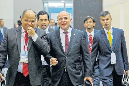  ?? /Reuters ?? Needs help: Venezuela's oil minister Manuel Quevedo, centre, at the Petrotech conference in Greater Noida, India on Monday.