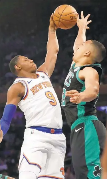  ?? AP ?? RJ Barrett, who scores team-high 26 points, drives to basket against Celtics forward Grant Williams.