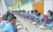  ?? HT PHOTO ?? ■ Students having their midday meals in Chhurchhur­ia Primary school on Tuesday.