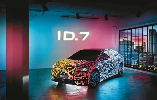  ?? VOLKSWAGEN OF AMERICA ?? The Volkswagen ID.7 is the brand’s first electric sedan. It is shown here with a bespoke multicolor paint job that can be illuminate­d at night.