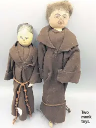  ??  ?? Two monk toys.