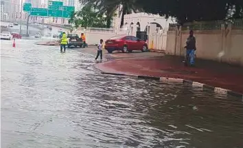  ?? Ahmed Kutty & Devadasan/Gulf News ?? Most areas in the country saw heavy rain yesterday. Right: A stretch of road in Sharjah’s Al Khan area after a downpour.