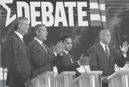  ??  ?? Bill de Blasio, left, Tim Ryan, Julian Castro and Cory Booker at Wednesday’s debate in Miami. JIM WATSON/AFP/GETTY IMAGES