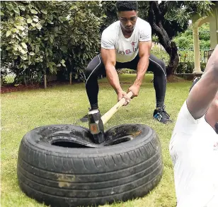  ?? GLADSTONE TAYLOR/PHOTOGRAPH­ER ?? The Jackhammer: Using a sledgehamm­er and an old tyre, repeatedly hit the hammer against the tyre. Engage the arms and follow through into a deep squat. Do this for 1020 minutes in bursts of 2-3 minutes.