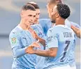  ?? AFP ?? Man City’s Phil Foden, left, celebrates his goal against Bournemout­h.