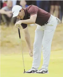  ?? AP PHOTO ?? SO CLOSE: Rory McIlroy misses a birdie putt on the first hole during yesterday’s third round of the British Open at Carnoustie.