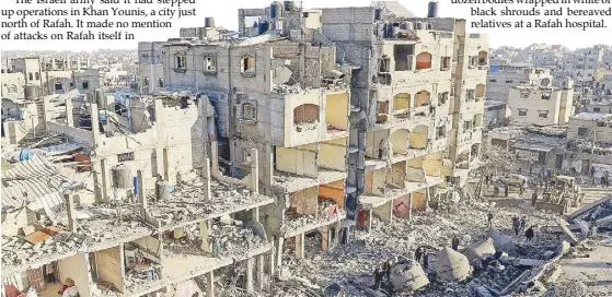  ?? AFP ?? Photo shows a destroyed building and the rubble of the al-Faruq mosque on Feb. 22 following an overnight Israeli air strike at the Rafah refugee camp in the southern Gaza Strip.