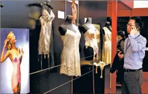  ?? GAO ER’QIANG / CHINA DAILY ?? A profession­al buyer checks lingerie products on display at an internatio­nal fashion and lingerie fair in Shanghai in 2014.