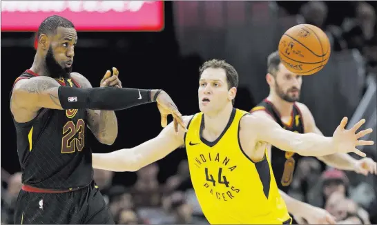  ?? Tony Dejak ?? The Associated Press Cavaliers forward Lebron James passes against Indiana Pacers forward Bojan Bogdanovic in Game 1 of their Eastern Conference first-round playoff game Sunday in Cleveland.