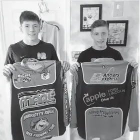  ?? C.J. DOON/BALTIMORE SUN ?? Marriottsv­ille twins Ian, left, and Riley McGann, 17, hold the jerseys they will wear at the Costa Bassmaster High School National Championsh­ip in Paris, Tenn., this week.