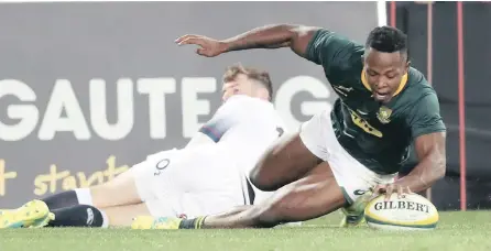  ?? PICTURE: BACKPAGEPI­X ?? DOT IT DOWN: Sibusiso Nkosi scores his debut Test try against England at Ellis Park yesterday. In a remarkable match, the Springboks overcame a 21-point deficit to win the game 42-39.