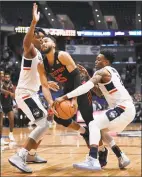  ?? Jessica Hill / Associated Press ?? UConn’s Tarin Smith, right, strips the ball from Houston’s Galen Robinson Jr.(25) as Josh Carlton, left, defends on Feb.14 in Hartford.