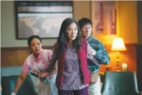  ?? ALLYSON RIGGS/A24/TNS ?? From left, Stephanie Hsu, Michelle Yeoh and Ke Huy Quan in "Everything Everywhere All at Once."