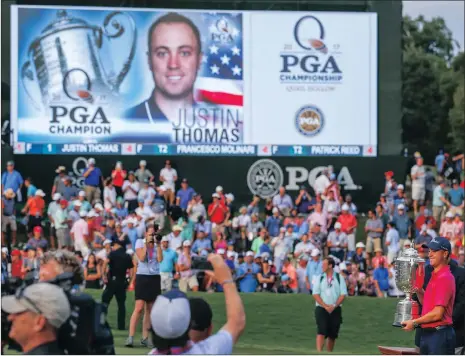  ?? Picture: ERIK LESSER, EPA ?? THE NAME IN BRIGHT LIGHTS: Justin Thomas poses for photos with the Wanamaker Trophy after winning the PGA Championsh­ip at Quail Hollow on Sunday.