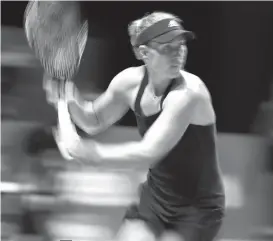  ?? AP Photo ?? WINNER. Angelique Kerber of Germany plays a return while competing against Naomi Osaka of Japan during their women's singles match at the WTA Finals in Singapore, Oct. 24, 2018.